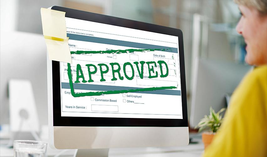 A computer screen with a stamp on it