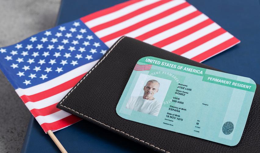 A passport and flag on a table