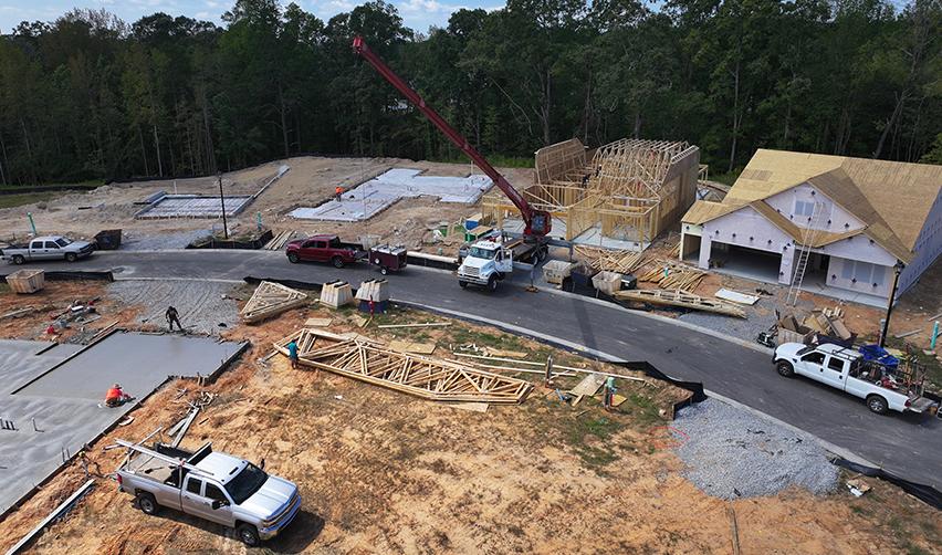 A construction site with trucks and a crane