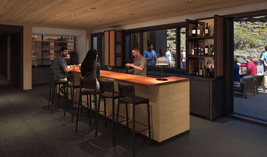 People sitting at a bar at the Snake River Sporting Club. 