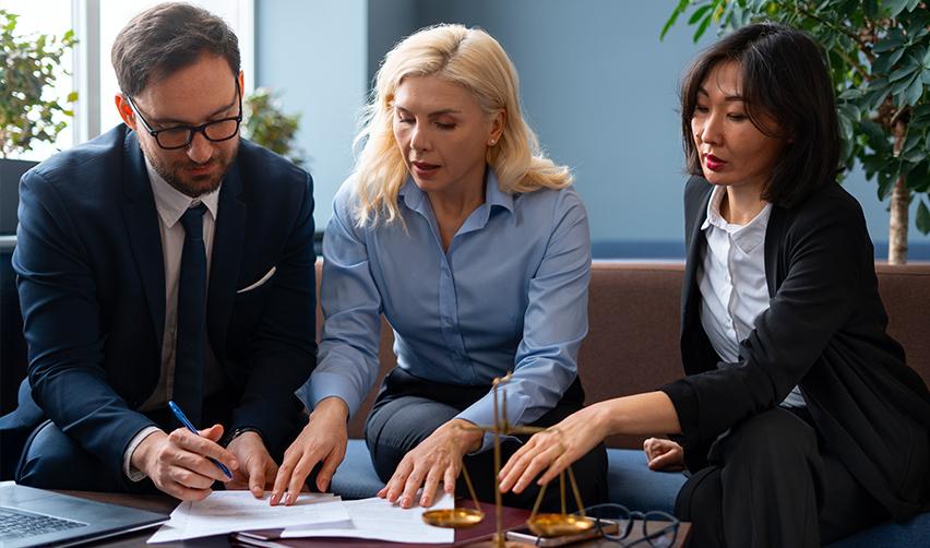 An EB5 investor and their family members file form I-526E immigrant petition at an immigration attorney's office.