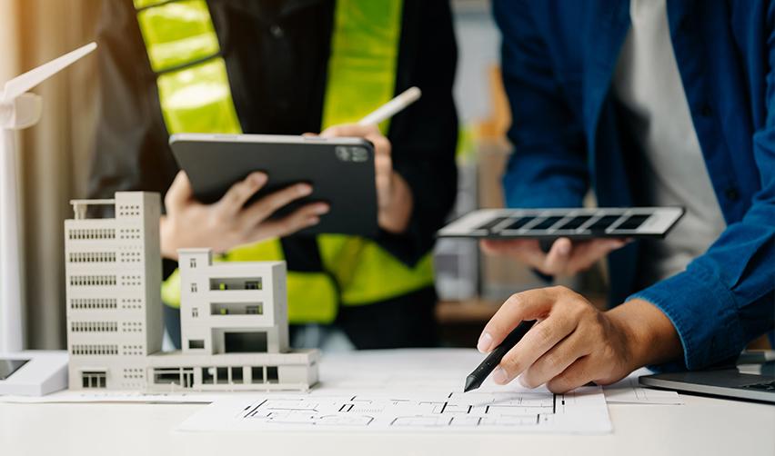 A close-up of engineers or project developers working on an EB5 investment project.
