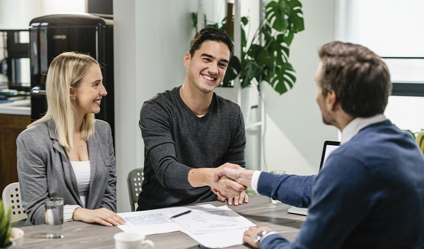 An EB5 investor discussing the loan terms of their lawful commercial business activity with a regional center management team.
