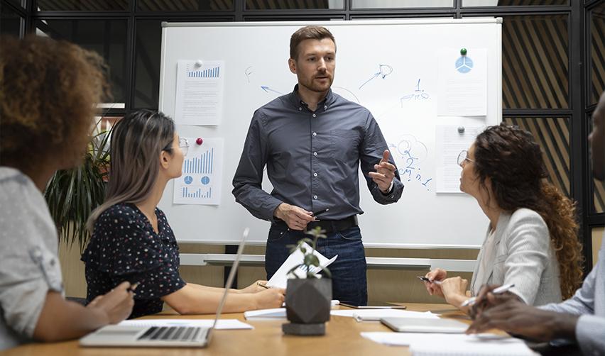 A group of EB5 industry professionals doing an economic analysis of their project's success, discussing inherent risks and the project's viability.