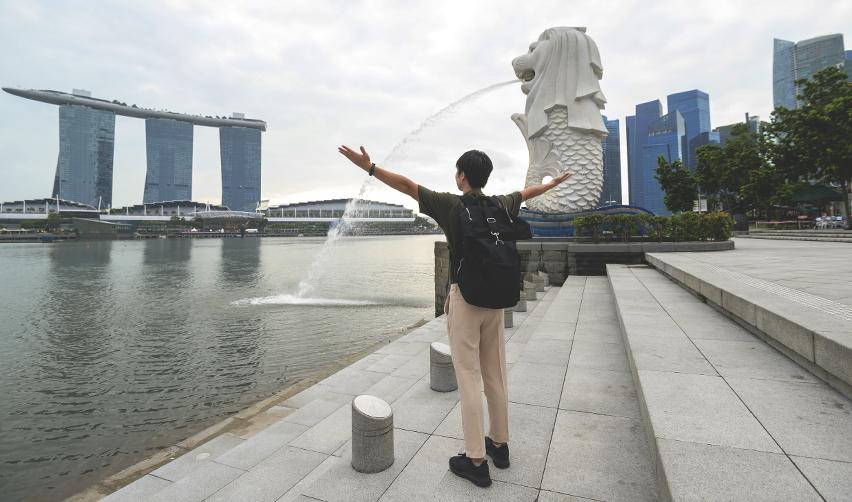 A Singaporean EB5 investor celebrating his new immigrant US visa.