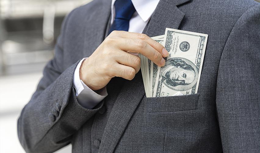 Hands protecting a piggy bank, symbolizing financial protections offered by reputable EB5 regional centers for secure investments.