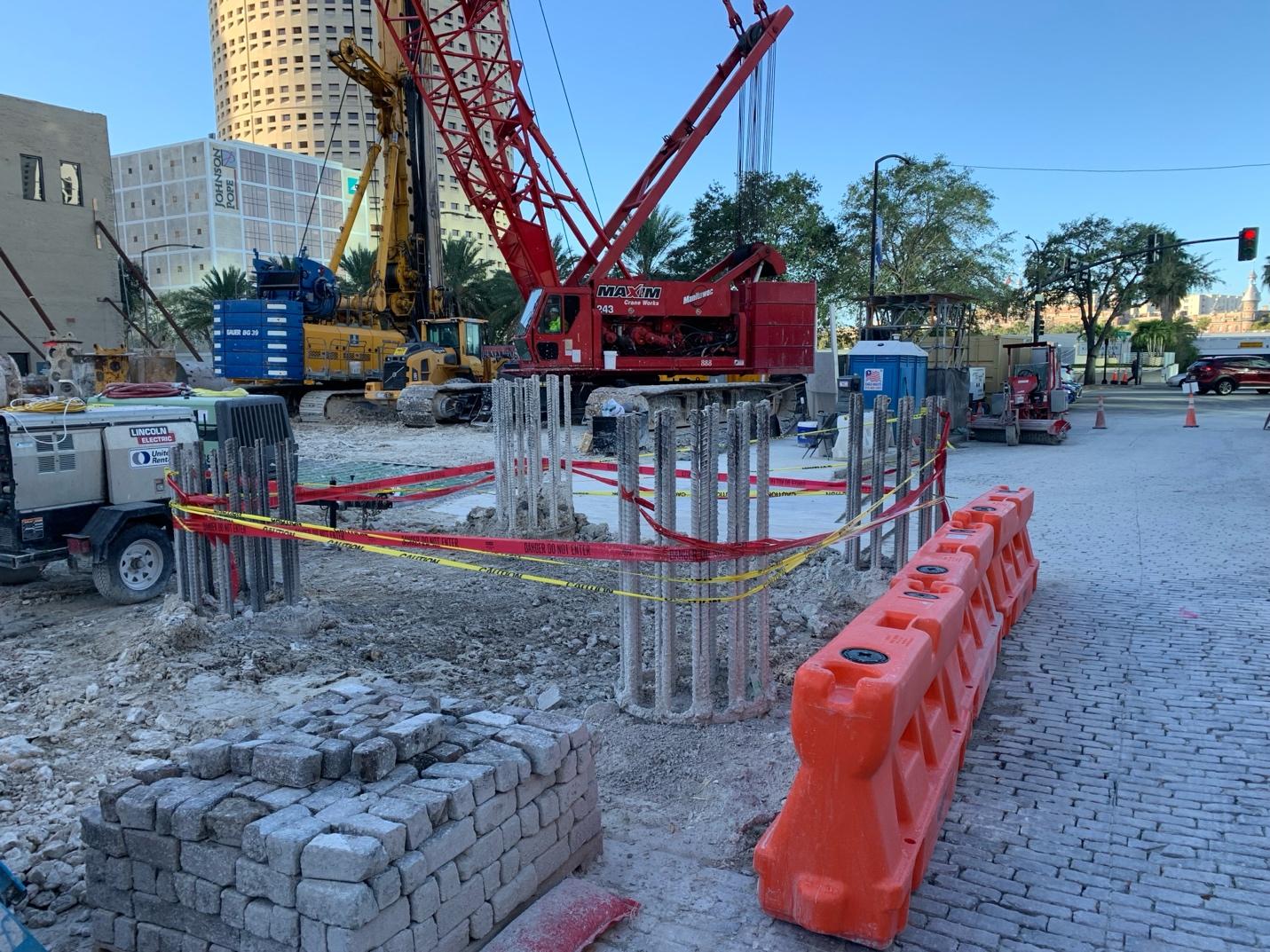 Construction site with construction equipment and a crane