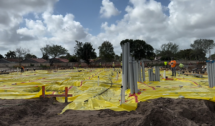 A construction site with yellow tarp