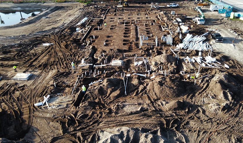 A construction site with many piles of dirt