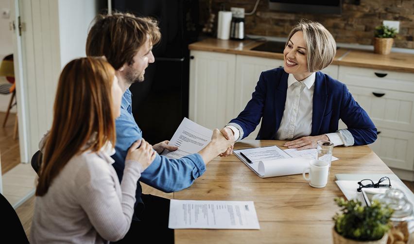 Happy couple meeting with an EB5 advisor, symbolizing trust, expert support, and confidence in the EB5 Green Card process.