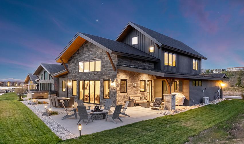 A house with a patio and lawn