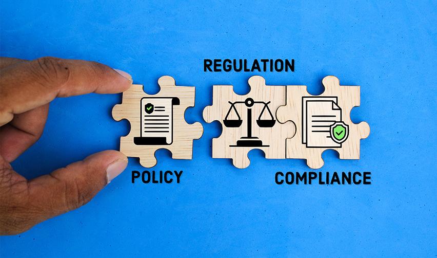 Puzzle pieces labeled policy, regulation, and compliance fitting together, illustrating the importance of EB5 reporting and immigration requirements.