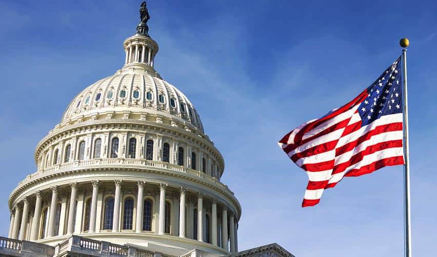 The U.S. Capitol building with an American flag, representing U.S. immigration policy and federal oversight of the EB5 investor visa program.